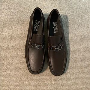 Never worn Ferragamo brown dress shoes.  Left sole needs repaired.
